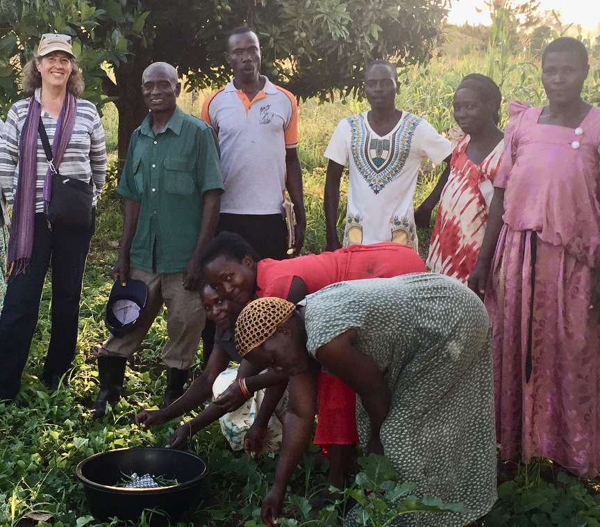 a group of ugandan farmers with an american woman on the far left 