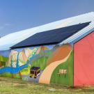 Photo illustration: Climate mural on side of barn