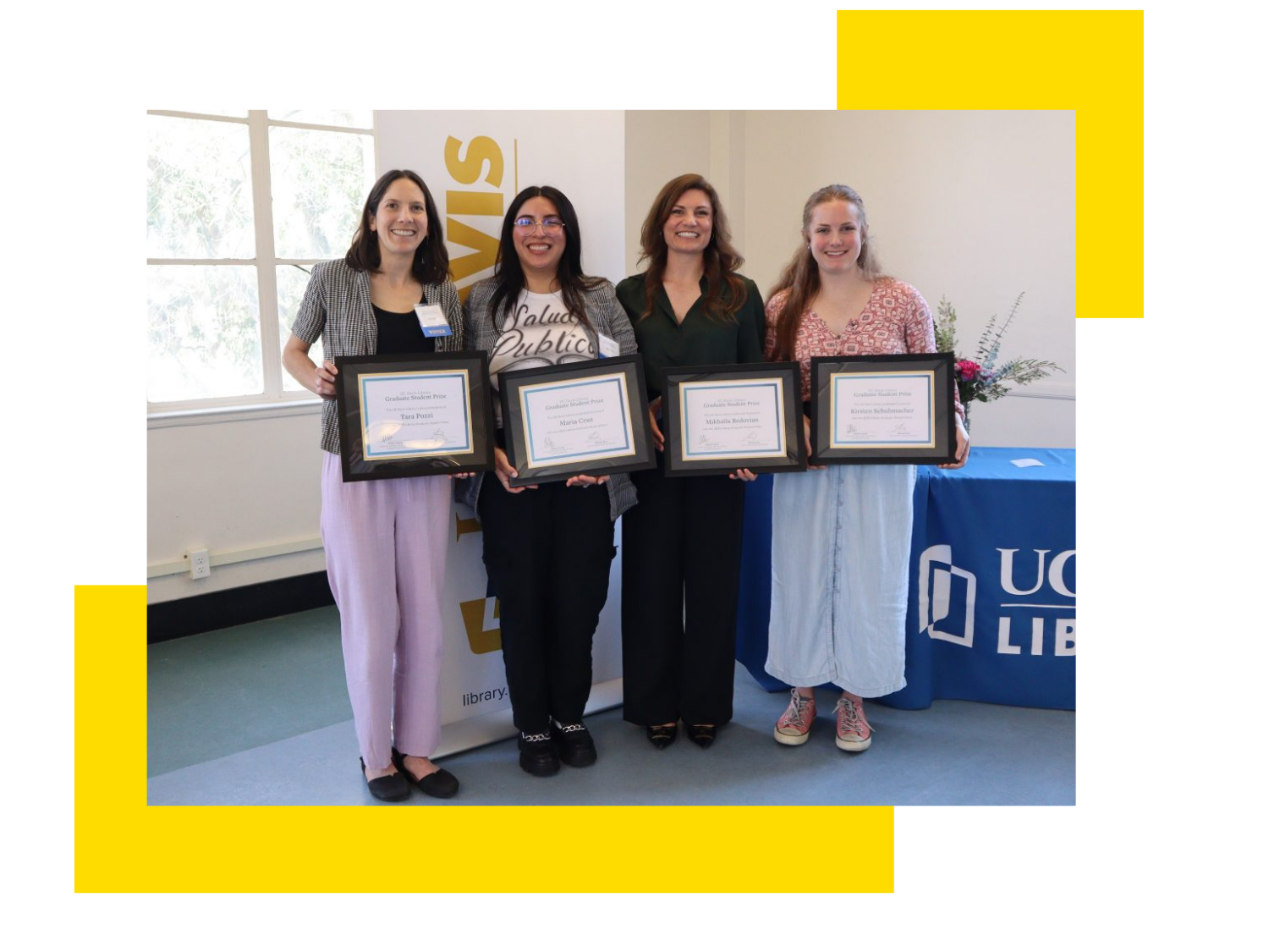 Graphic of four graduate students standing side by side, smiling and holding their awards