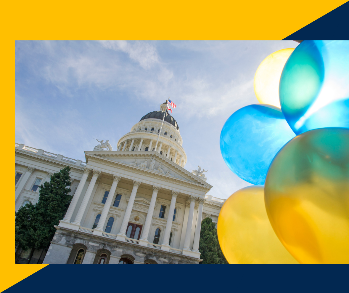 State Capitol in Sacramento in front of blue skies and colorful balloons to its right