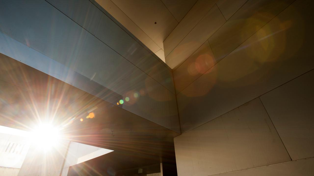 Credit: Gregory Urquiaga light shines through a concrete building