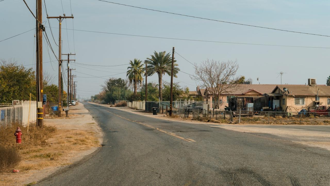 Teviston, Calif., was once an all-black community in the Central Valley that did not have running water. Credit: Ryan Christopher Jones for The New York Times Dusty street in rural Teviston California