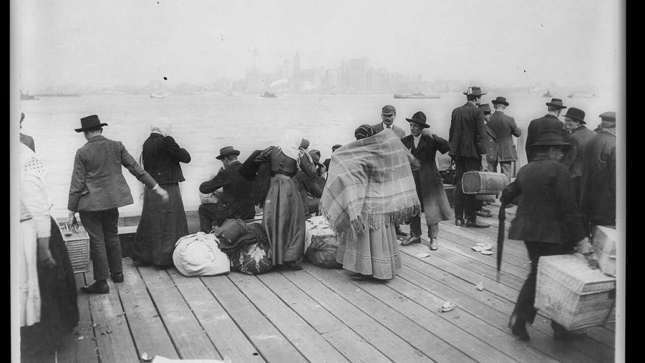 Immigrants waiting to be transferred, Ellis Island, Oct. 30, 1912. Credit...Library of Congress