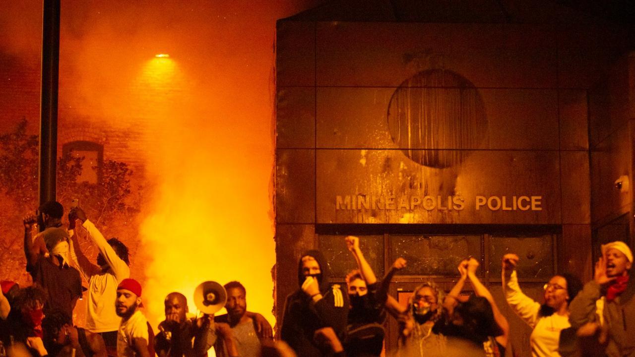 fire burning outside a minneapolis police department
