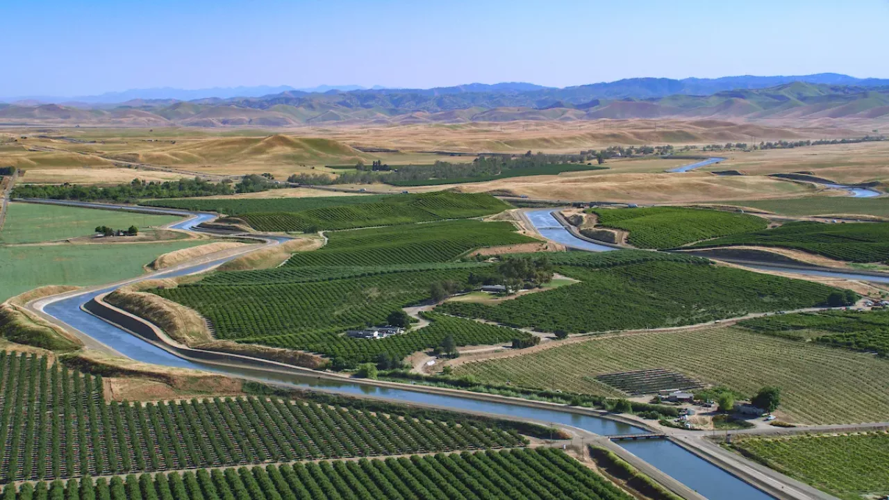 Aerial view of the State Water Project (SWP) California Aqueduct San Luis Canal and the federal Central Valley Project (CVP) Delta-Mendota Canal traveling through Merced County.