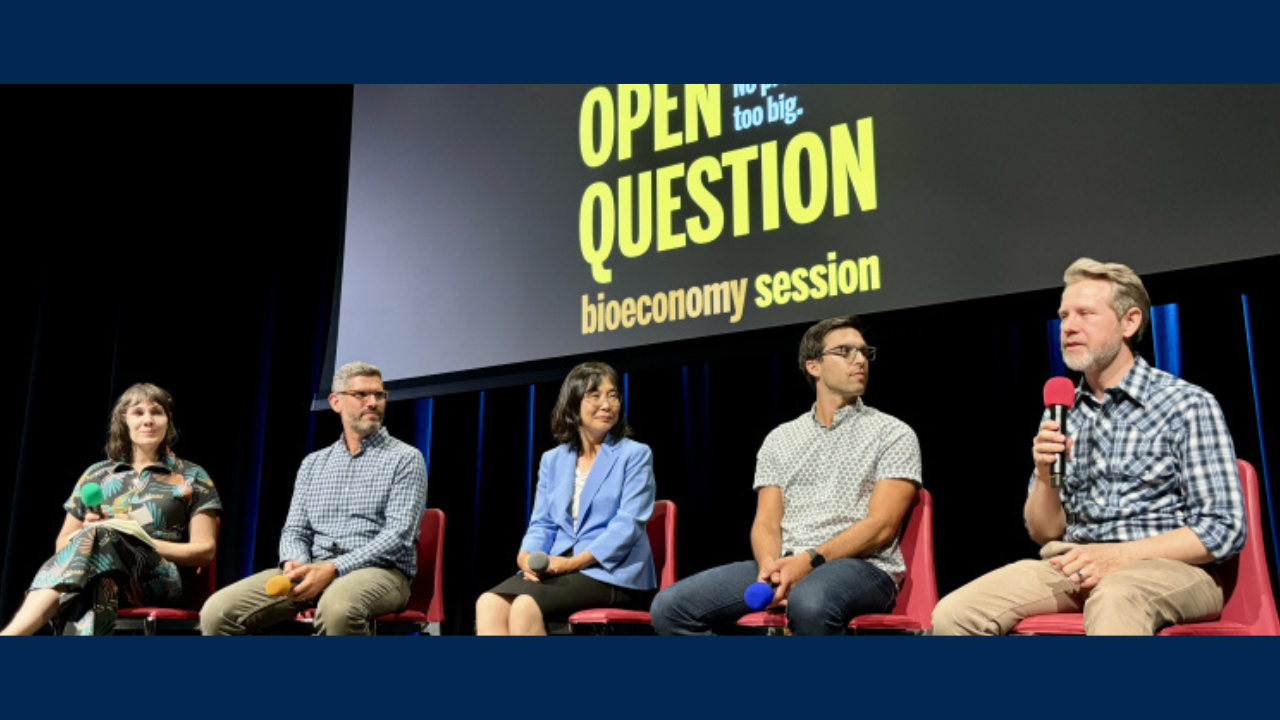 Five panelists sit on stage, speaking at the Bioeconomy-focused Open Question event