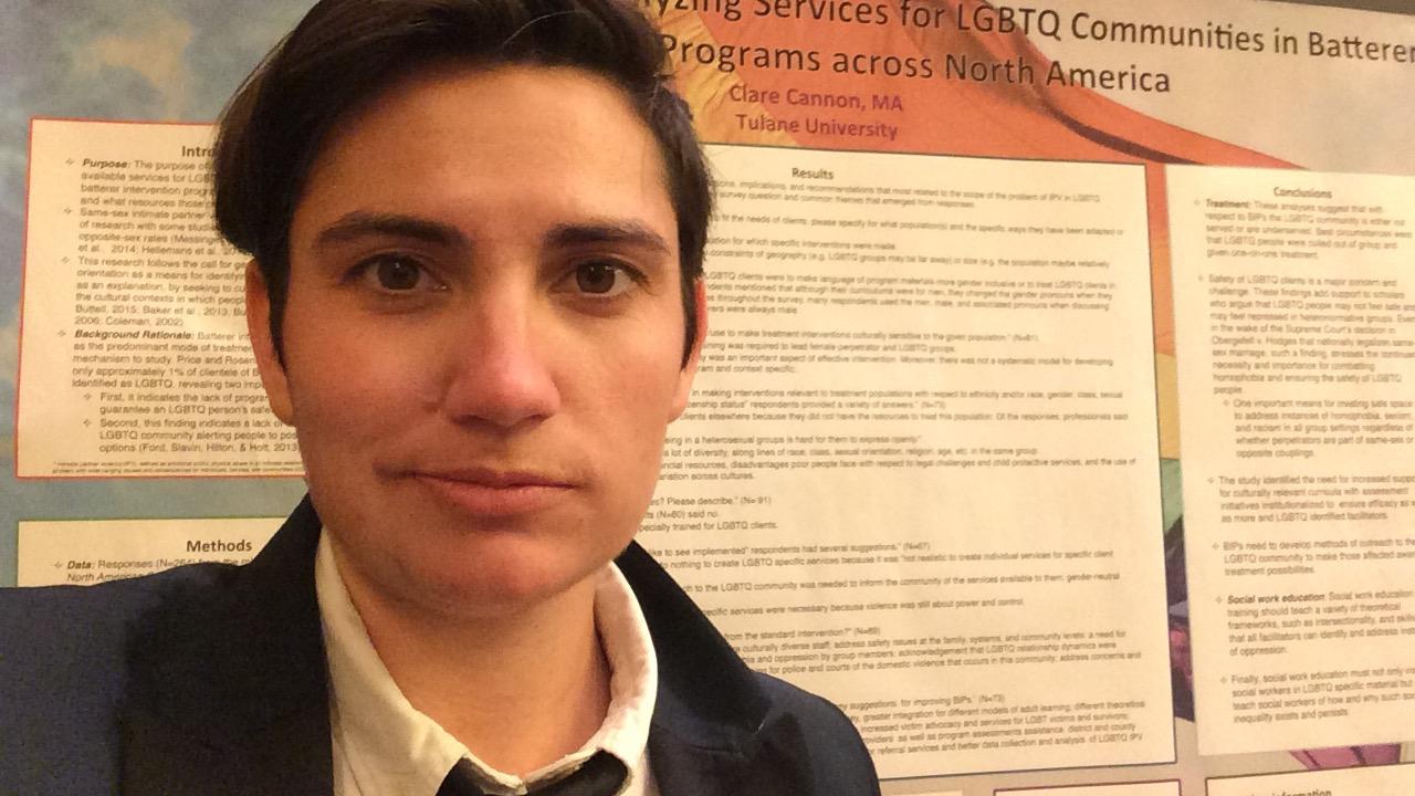clare cannon at conference standing in front of a research poster