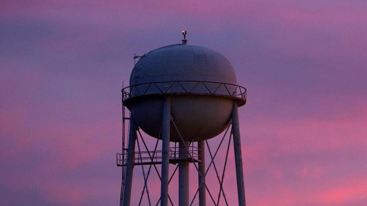 purple sky with water tower