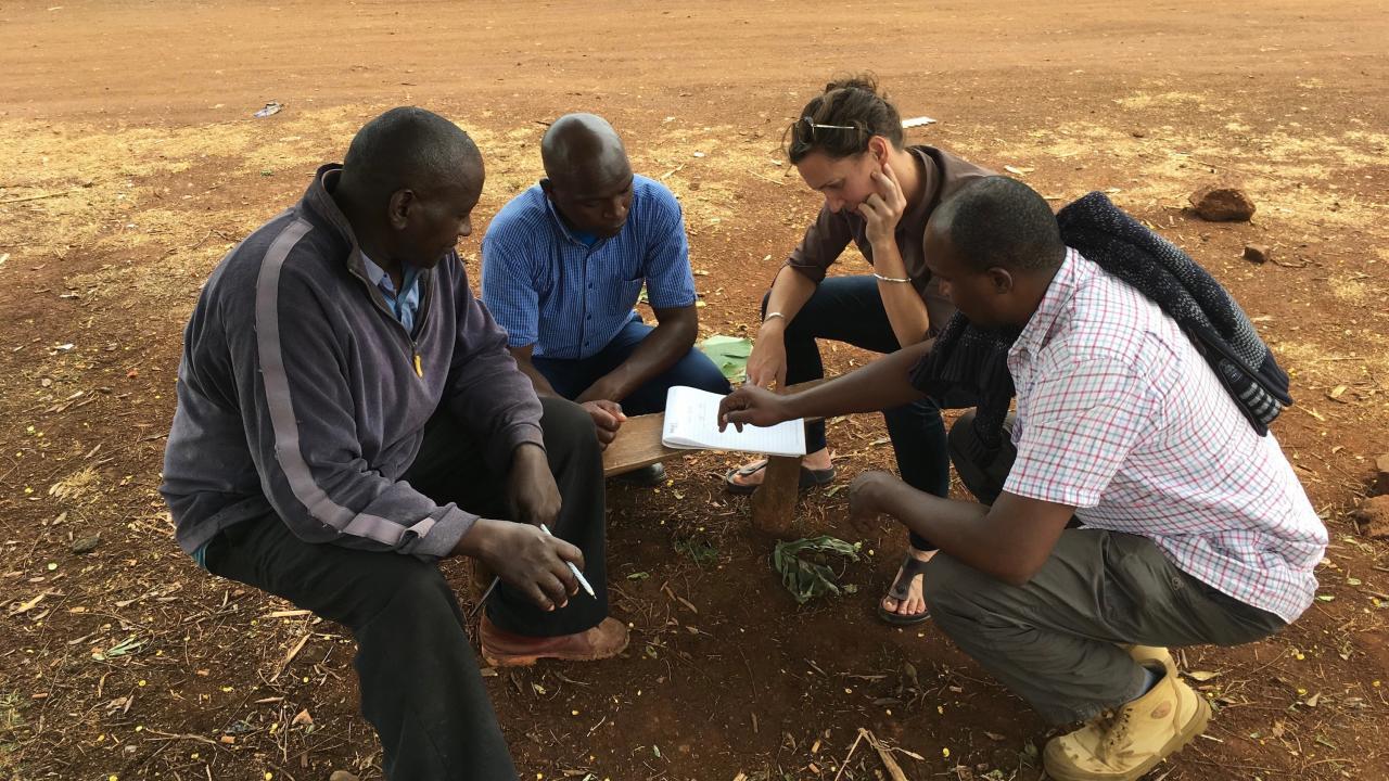 Waterman drafting construction plans for a moringa shade drying structures using local materials in Meru, Kenya.