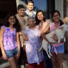 a multi generation asian american and pacific islander family with a dog