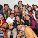 Professors Nancy Erbstein and Jonathan London surrounded by students in Nepal.