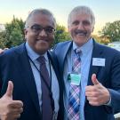Ashish Jha, White House official, and Richard Corsi, UC Davis faculty, both giving thumbs-up outside the White House
