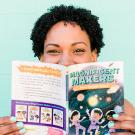 Close up photo of Theanne Griffith smiling while holding a book titled "The Magnificent Makers"