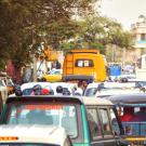 Buses, cars, and motorcyles congest a busy street in Jaipur, India