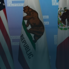 Three flags side by side (on the left is the Flag of the United States, in the middle is the Flag of California, and on the left is the Flag of Mexico)