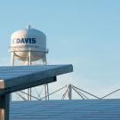 Tops of solar panels with UC Davis water tower in background
