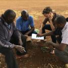 Waterman drafting construction plans for a moringa shade drying structures using local materials in Meru, Kenya.